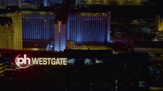 DCA03_205 - 4K aerial stock footage of approaching Planet Hollywood Towers Westgate, Las Vegas, Nevada Night