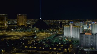 DCA03_217 - 4K aerial stock footage of zooming in on Luxor Hotel and Casino, Las Vegas, Nevada Night