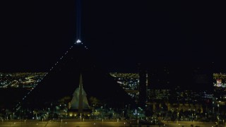 DCA03_218 - 4K aerial stock footage of Luxor Hotel and Casino, Las Vegas, Nevada Night