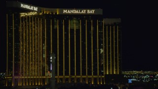 DCA03_219 - 4K aerial stock footage of flying by Luxor Hotel and Casino, revealing Mandalay Bay, Las Vegas, Nevada Night