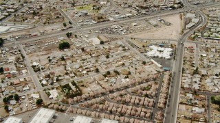 DCA04_003 - 4K aerial stock footage flying over suburbs and warehouses in East Las Vegas, Nevada