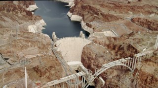 DCA04_006 - 4K stock footage aerial video flying away from Hoover Dam, Boulder City, Nevada