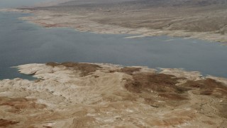DCA04_014 - 4K aerial stock footage of flying by shore of East Point Bay on Lake Mead, Las Vegas, Nevada