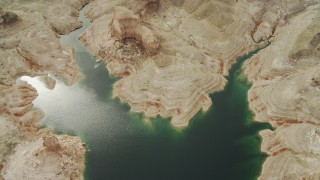 DCA04_016 - 4K aerial stock footage of a bird's eye view of a desert shoreline of a bay on Lake Mead, Las Vegas, Nevada