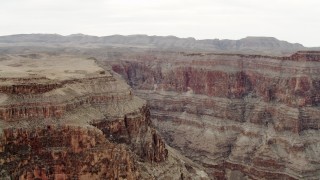 DCA04_030 - 4K aerial stock footage of flying by jagged cliffs in Grand Canyon, Arizona