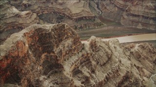 DCA04_043 - 4K aerial stock footage of flying over a rock formation near the Colorado River in Grand Canyon, Arizona