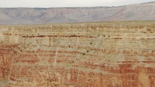 DCA04_047 - 4K aerial stock footage of panning across summit of a cliff in Grand Canyon, Arizoa