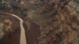 DCA04_052 - 4K aerial stock footage of panning across the Colorado River, and tilt to rock formations in Grand Canyon, Arizona