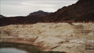 DCA04_064 - 4K aerial stock footage of flying over shoreline in Lake Mead, Nevada