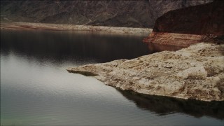 DCA04_066 - 4K aerial stock footage of flying low over Lake Mead shoreline, Nevada