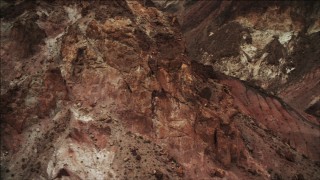 DCA04_072 - 4K aerial stock footage of orbiting a jagged slope in the Hiller Mountains; Nevada