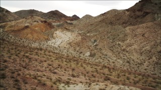 DCA04_074 - 4K aerial stock footage of flying over a desert slope in Hiller Mountains, Nevada