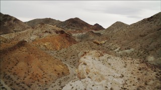 DCA04_075 - 4K aerial stock footage of flying over foothills toward Hiller Mountains, Nevada