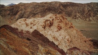DCA04_079 - 4K aerial stock footage of flying by a small mountain in Hiller Mountains, Nevada