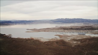DCA04_092 - 4K aerial stock footage of flying by the shore of Lake Mead, Nevada