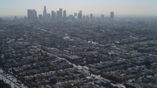 DCA05_023 - 4K aerial stock footage of flying over Highway 101, revealing Downtown skyline, Los Angeles, California