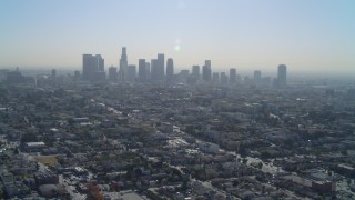 DCA05_024 - 4K aerial stock footage of approaching the Downtown skyline, Los Angeles, California
