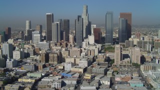 DCA05_031 - 4K aerial stock footage of East 4th Street, tilt to reveal Downtown skyline, Los Angeles, California