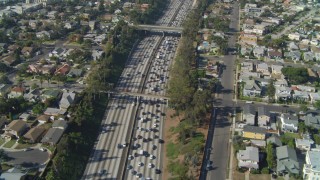 DCA05_057 - 4K aerial stock footage of following Interstate 10 through Pico-Union,tilt down, Los Angeles, California