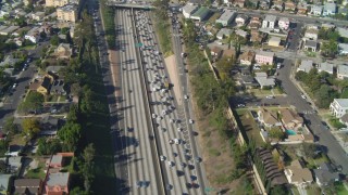 DCA05_058 - 4K aerial stock footage of heavy traffic on Interstate 10 through Pico-Union, Los Angeles, California