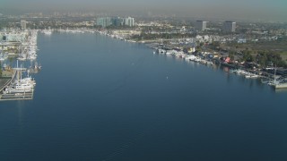 DCA05_068 - 4K aerial stock footage video of approaching boats in the marina, Marina Del Rey, California