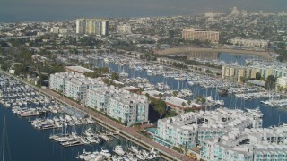 DCA05_070 - 4K aerial stock footage of boats in the marina and waterfront apartment buildings, Marina Del Rey, California