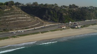 DCA05_096 - 4K aerial stock footage of flying by Highway 1, coast, Santa Monica State Beach, Santa Monica, California