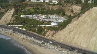 DCA05_098 - 4K aerial stock footage tilt to Highway 1, along the coast, Pacific Palisades, California