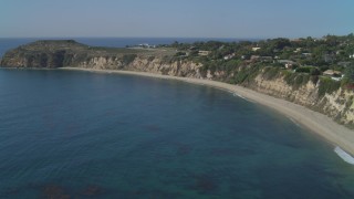 DCA05_130 - 4K aerial stock footage ascend near coastal mansion, Dume Cove, Malibu, California