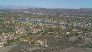 DCA05_141 - 4K aerial stock footage of flying by neighborhoods, surrounding Westlake Lake, Westlake Village, California
