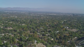 DCA05_156 - 4K stock footage aerial video of flying over Hidden Hills, approaching San Fernando Valley, California