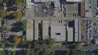 DCA05_164 - 4K aerial stock footage of a bird's eye view flying over commercial buildings and streets, Canoga Park, California