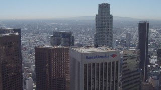 DCA06_018 - 4K aerial stock footage wide orbit around US Bank Tower, nearby skyscrapers, Downtown Los Angeles, California