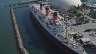 DCA06_024 - 4K aerial stock footage approach RMS Queen Mary, tilt for bird's eye of ship, Long Beach, California