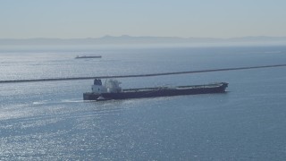 DCA06_028 - 4K aerial stock footage of a view of an oil tanker near breakwater, Long Beach, California
