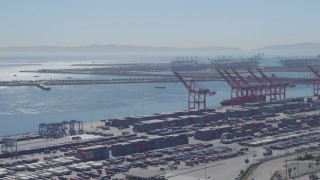 DCA06_039 - 4K stock footage aerial video of flying by cargo containers, cranes at Port of Long Beach, California