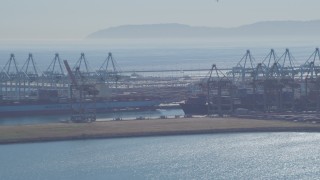 DCA06_042 - 4K aerial stock footage flyby cargo ships, containers and cranes, Port of Los Angeles, San Pedro, California