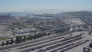 DCA06_043 - 4K aerial stock footage flyby cargo containers, reveal bridge at Port of Los Angeles, San Pedro, California