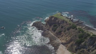 DCA06_051 - 4K aerial stock footage flyby coastal cliff to reveal small cove in Rancho Palos Verdes, California