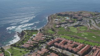 DCA06_053 - 4K aerial stock footage flyby coast, reveal to reveal a resort and a golf course at Rancho Palos Verdes, California