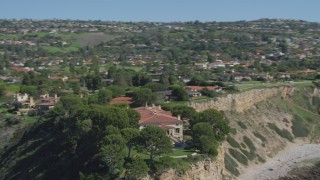 DCA06_057 - 4K aerial stock footage orbit a mansion on a cliff, overlooking ocean in Palos Verdes Estates, California