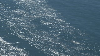 DCA06_059 - 4K aerial stock footage of shimmering sunlight on the ocean in Southern California