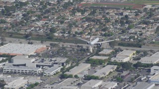 DCA06_061 - 4K aerial stock footage of a cargo jet coming in for landing, LAX (Los Angeles International Airport), Los Angeles, California