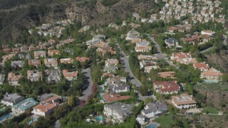 DCA06_071 - 4K aerial stock footage of approach and orbit mansions in Bel Air, California