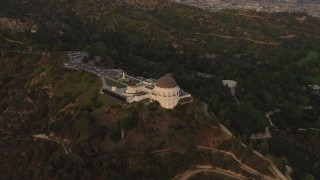 DCA07_003 - 4K aerial stock footage of orbiting the Griffith Observatory, Los Angeles, California, sunset