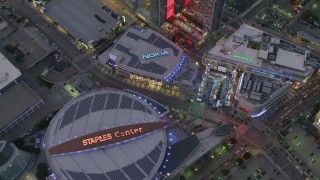 DCA07_018 - 4K aerial stock footage of orbiting Staples Center, Nokia Theater and LA Live, Downtown Los Angeles, California, twilight