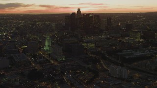 DCA07_024 - 4K aerial stock footage of approaching Los Angeles City Hall, revealing Downtown skyline, Los Angeles, California, twilight