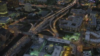 DCA07_027 - 4K aerial stock footage of flying by Highway 101, pan left, Downtown Los Angeles, California, night