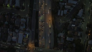 DCA07_033 - 4K aerial stock footage of bird's eye view flying over Highway 101, heavy traffic, Silverlake, California, night