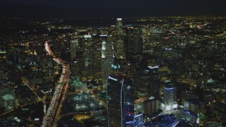 DCA07_059 - 4K aerial stock footage of The Ritz-Carlton, skyscrapers, Highway 110, Los Angeles, California, night